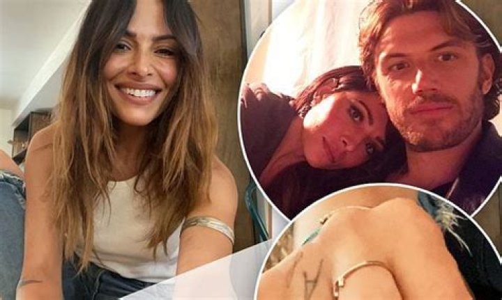 Adam Demos' girlfriend and co-star Sarah Shahi reveals the letter 'A' tattooed to her hand