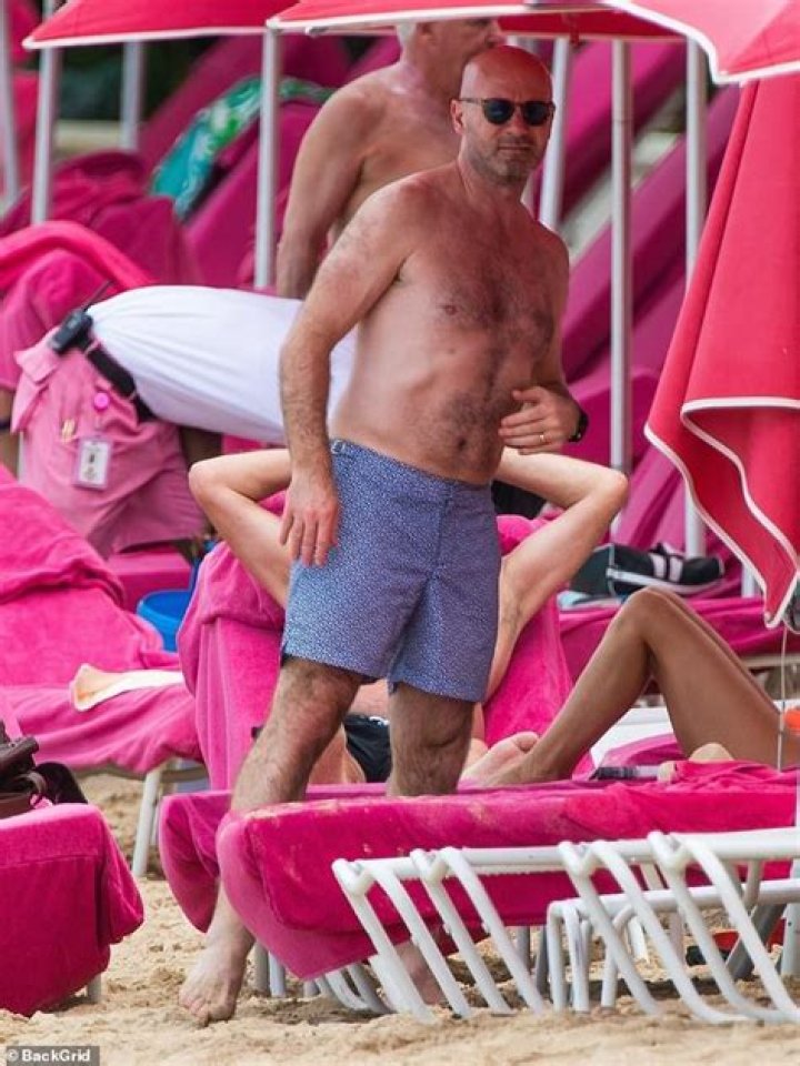 Alan Shearer goes shirtless for day at the beach with his wife Lainya in Barbados 