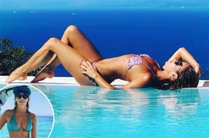Amanda Holden, 50, showcases her incredible bikini body as she soaks up the sun on holiday