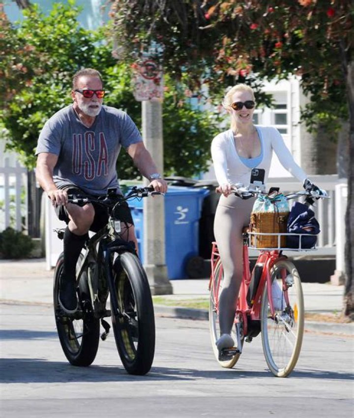 Arnold Schwarzenegger, 73, enjoys a bicycle ride with longtime girlfriend Heather Milligan, 46