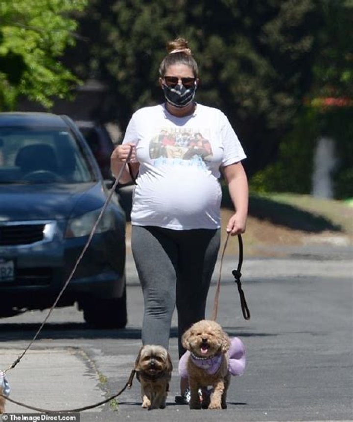 Brittany Cartwright wears a classic Friends T-shirt as she and Jax Taylor take their dogs for a walk