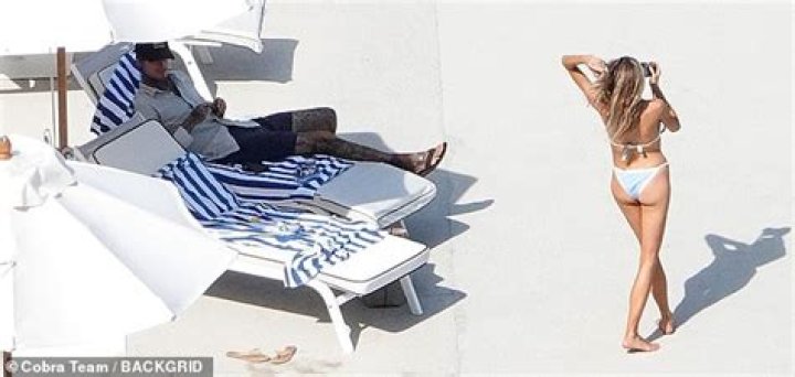 Charlotte McKinney flaunts her toned legs and taut torso in the Italian sun with her boyfriend