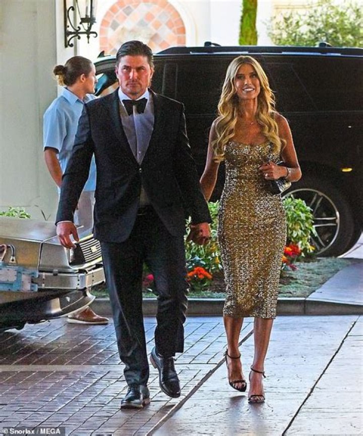 Christina Hall stuns in glitzy gold dress as she arrives at Laguna Beach hotel with husband Joshua Hall after taking a joyride in a DeLorean
