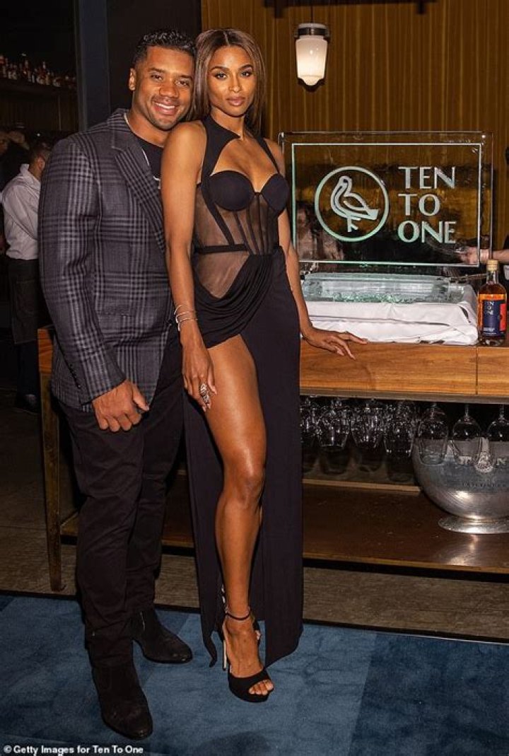 Ciara shows off her phenomenal figure in a bodysuit while trying her Lita combat boots on for size