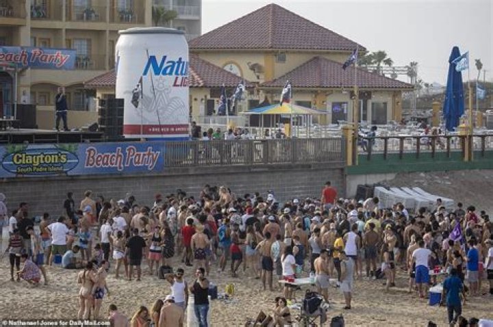 Covid US: Spring breakers ditch masks and social distancing rules on South Padre Island, Texas