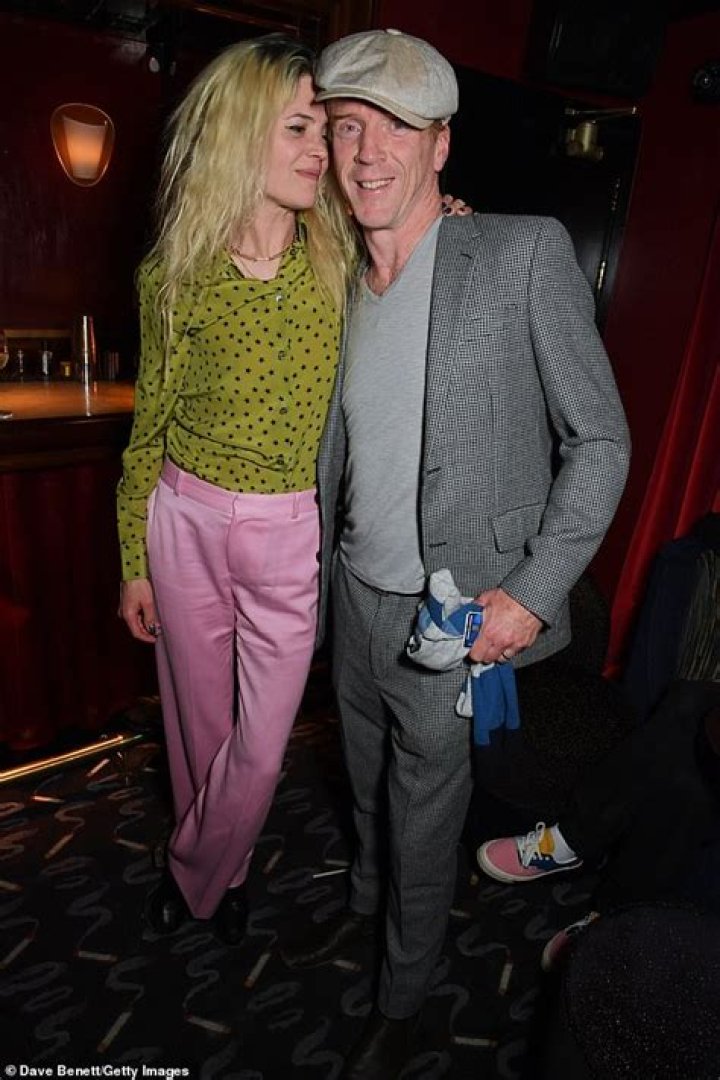 Damian Lewis and girlfriend Alison Mosshart look cosy as they pose arm-in-arm at dinner