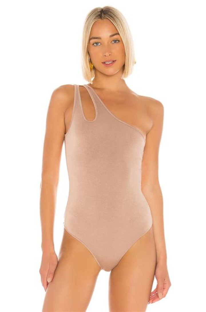 Demi Rose turns up the heat as she showcases her hourglass figure in a skin-tight bodysuit