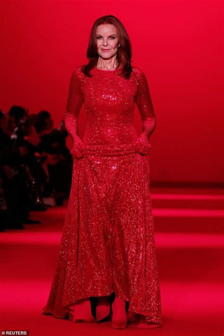 Desperate Housewives star Marcia Cross, 61, is a vision in a red gloved gown as she walks for Vetements during Paris Fashion Week