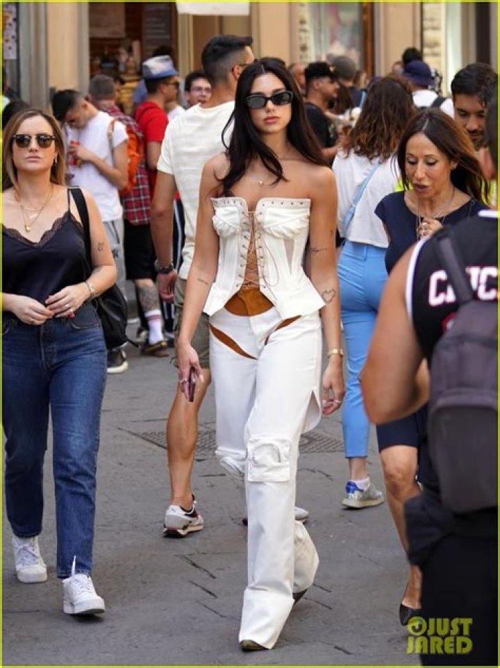 Dua Lipa Wears Cutout Pants & Corset Top While Sightseeing in Florence