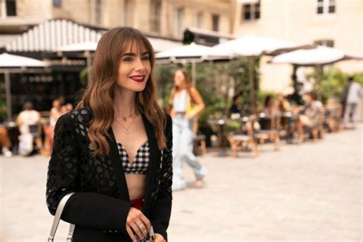Emily In Paris star Lily Collins changes from a bikini into a high-style ensemble