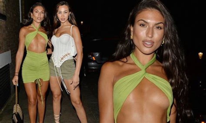 Emily Miller turns heads in a revealing green mini dress while out for dinner with Tabitha Clifft
