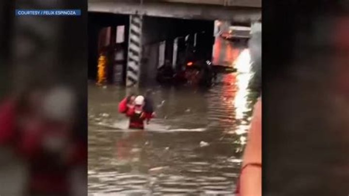 Eyewitness video shows Denver firefighter rescuing two children from flooding