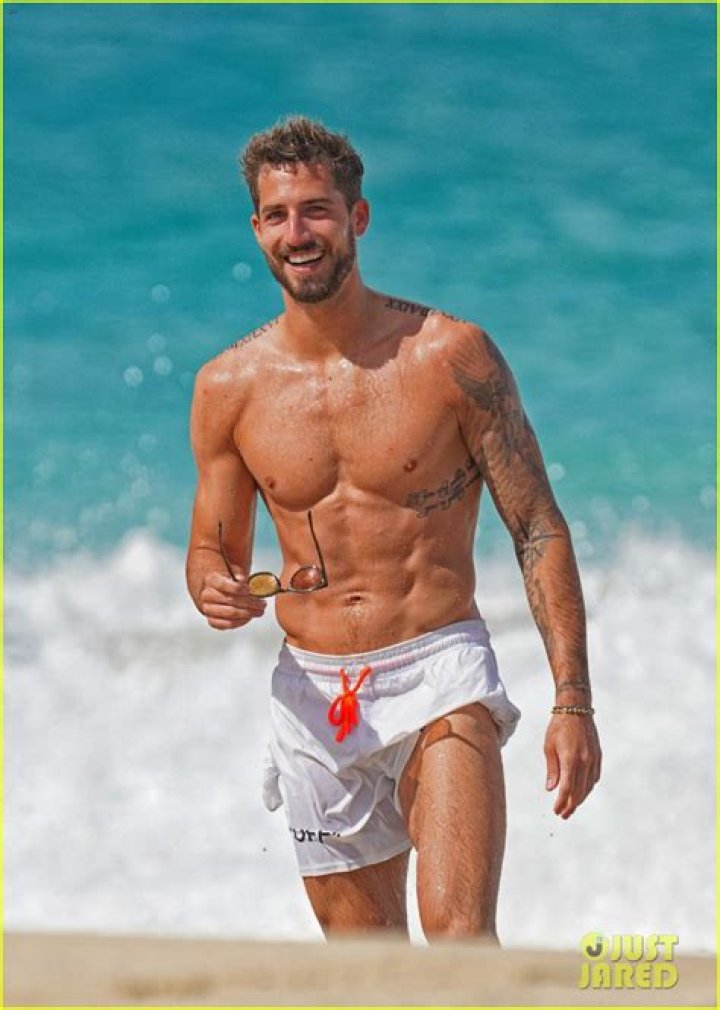 Footballer Kevin De Bruyne goes shirtless during a day on a beach with his family in Ibiza