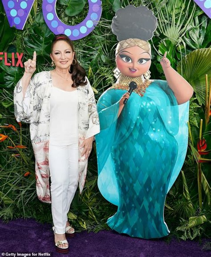Gloria Estefan strikes a pose with her animated character Marta at Vivo screening