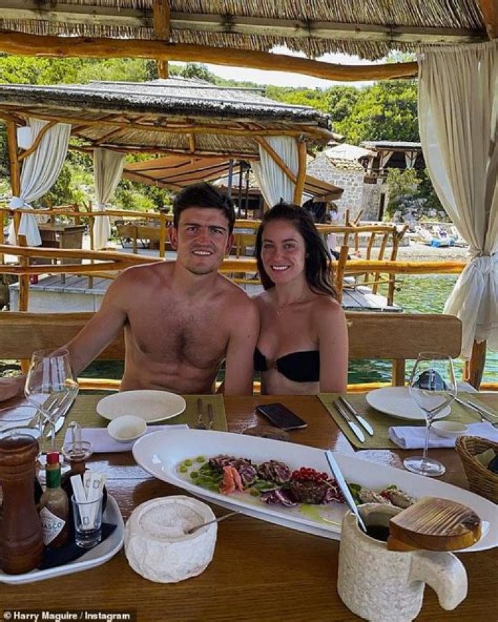 Harry Maguire shows off his muscular frame as he joins fiancée Fern Hawkins in Croatia