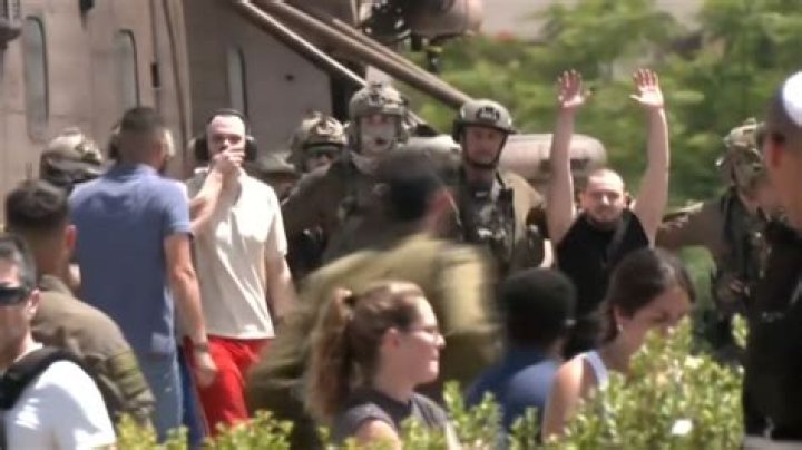 Israeli hostage, 21, paraded in Hamas video is seen dancing and smiling at music festival in footage shared by her family as her desperate mother says 'my baby is being held by the worst enemy in the world'