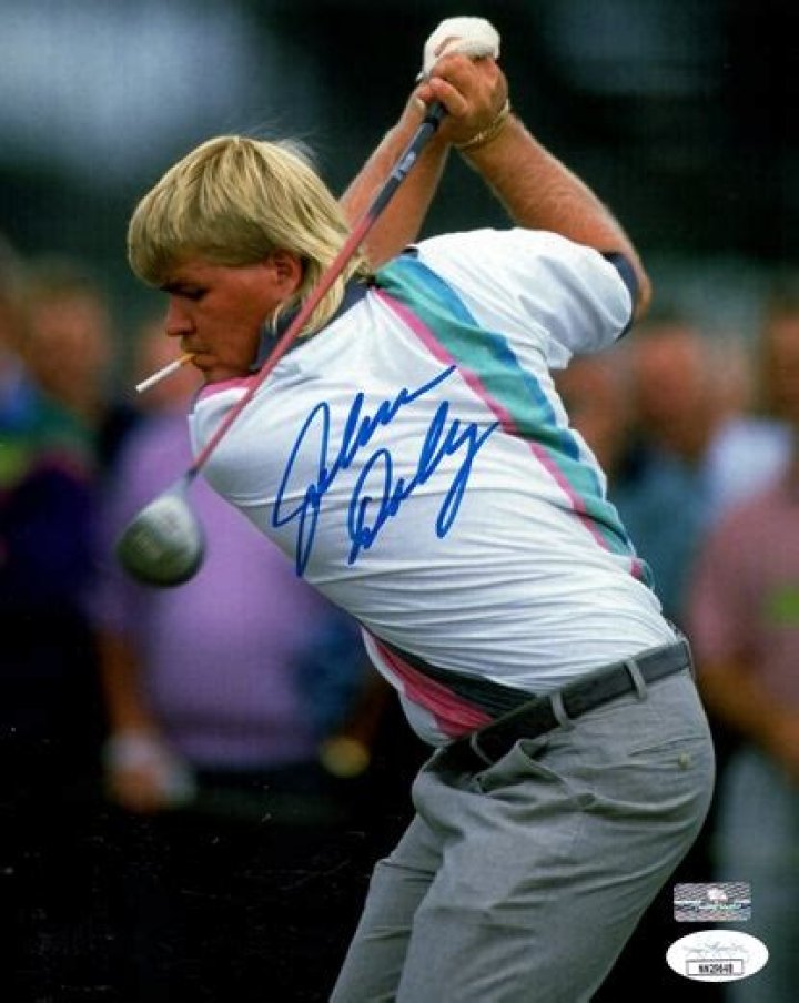 John Daly hilariously autographs a Diet Coke, peanut M&M's and box of cigarettes for a fan at PNC Championship as famously diet-averse golfer signs his favorite vices