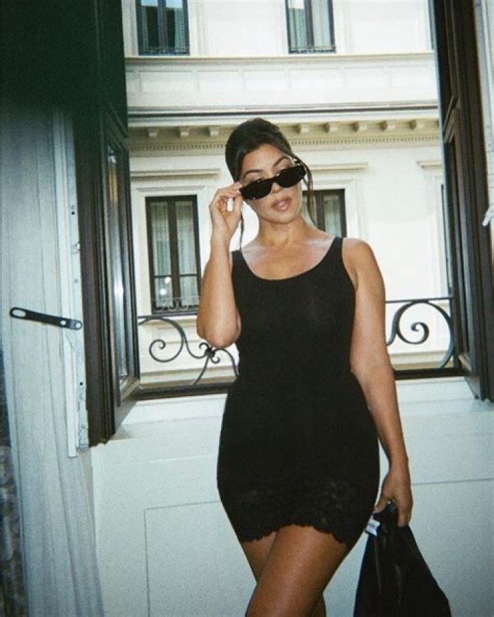 Kardashian fans say Kourtney is REALLY pregnant after she indulges in ‘chicken’ craving & shows off curves in red corset