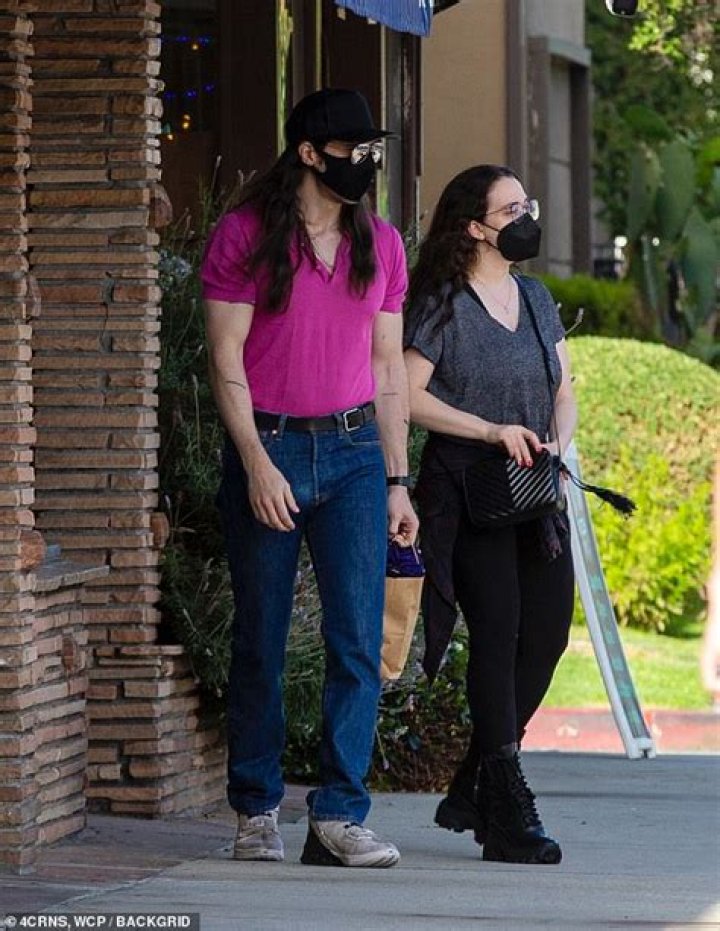 Kat Dennings and fiancé Andrew W.K. hold hands outside an arts and crafts store in Studio City