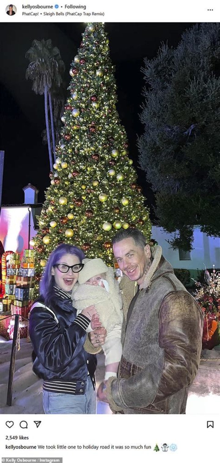 Kelly Osbourne and boyfriend Sid Wilson get into holiday spirit and take toddler son Sidney to colorful and immersive holiday experience in LA