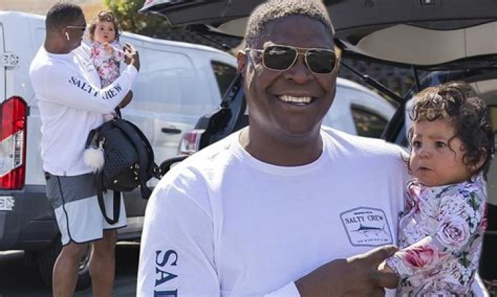 Keyshawn Johnson holds baby girl tight during outing following the death of oldest daughter Maia, 25