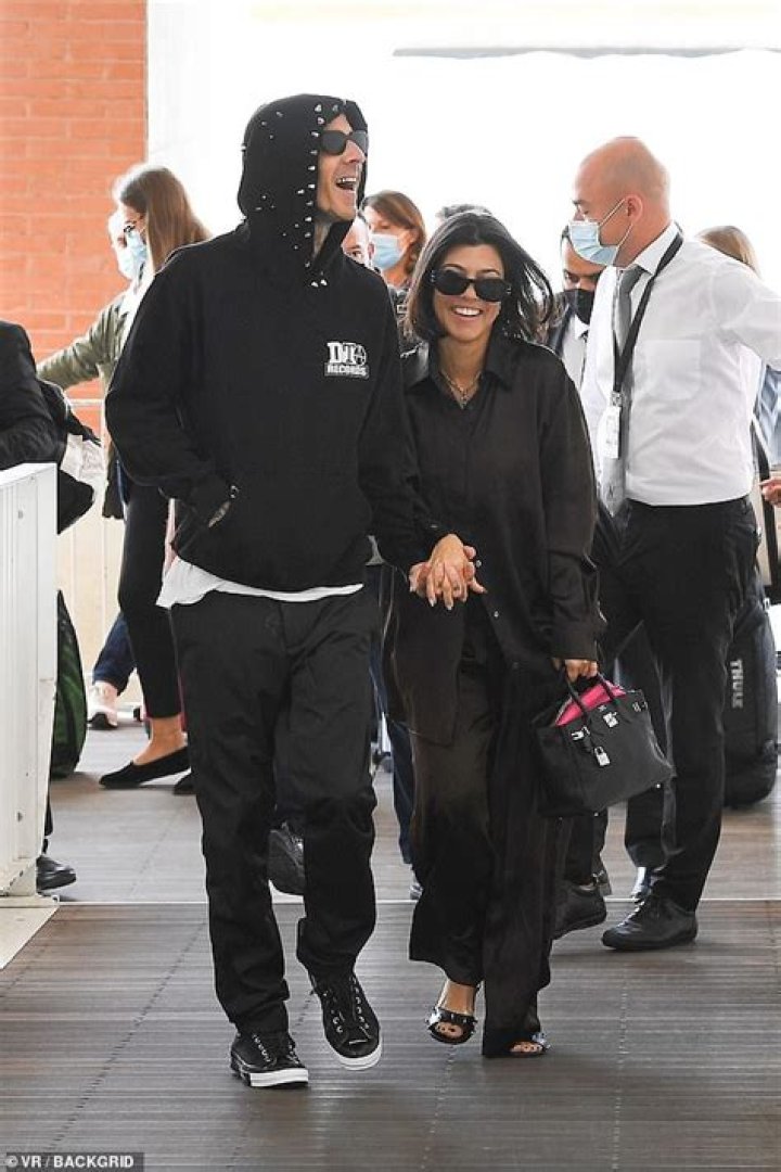 Kourtney Kardashian kisses and cosies up to beau Travis Barker