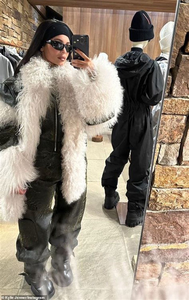 Kylie Jenner braves the cold in liquid black trousers and fur boots in Aspen