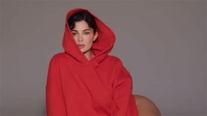 Kylie Jenner dares to bare as she goes without pants while modeling oversize red hoodie for her brand Khy