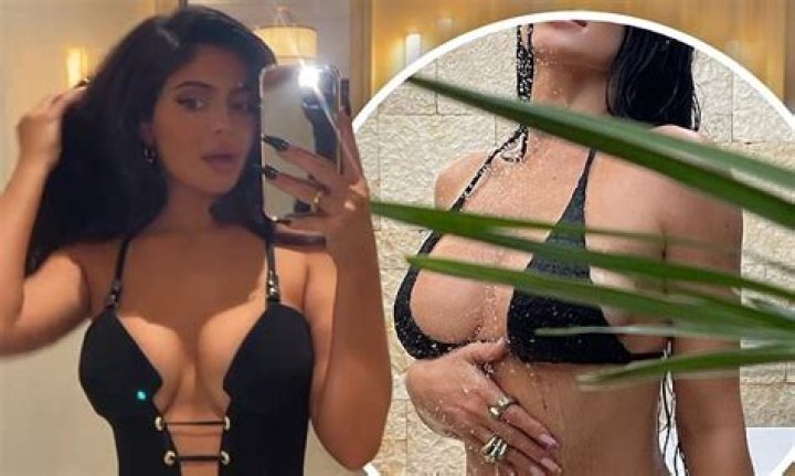 Kylie Jenner uploads a sizzling bikini snap before modeling a plunging black jumpsuit on Instagram