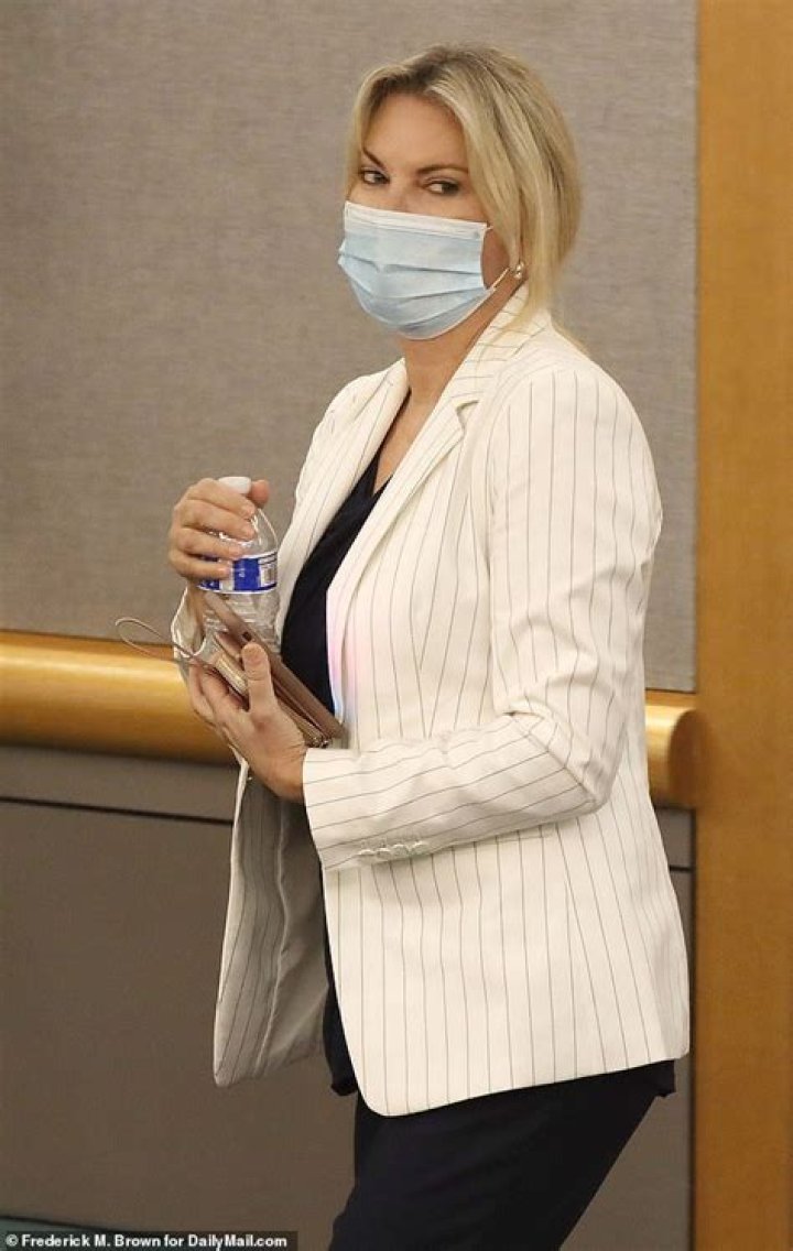 LA socialite Rebecca Grossman flanked by BODYGUARD heads to court for 'killing two young brothers