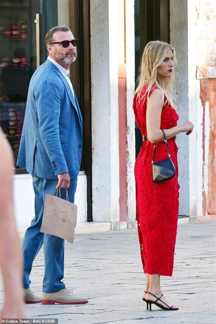 Liev Schreiber, 54, looks handsome in fitted blue suit beside glamorous girlfriend Taylor Neisen, 28