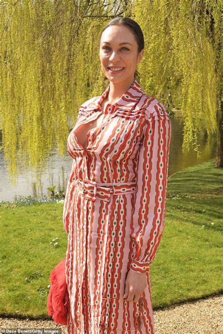 Lilly Becker cuts a chic figure in a pink patterned dress