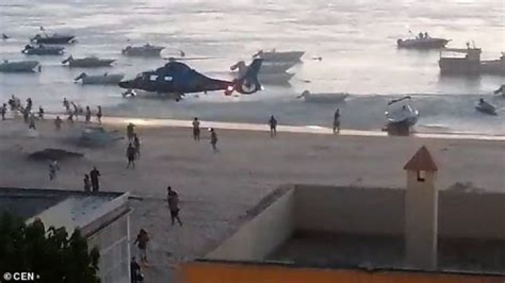 Looters driven away by Spanish police helicopter as they try to snatch CANNABIS from smugglers' boat