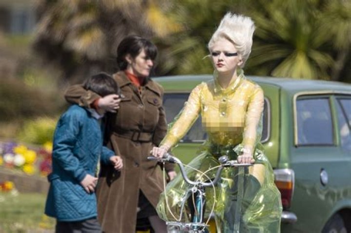 Maisie Williams bikes in sheer top while filming Sex Pistols series