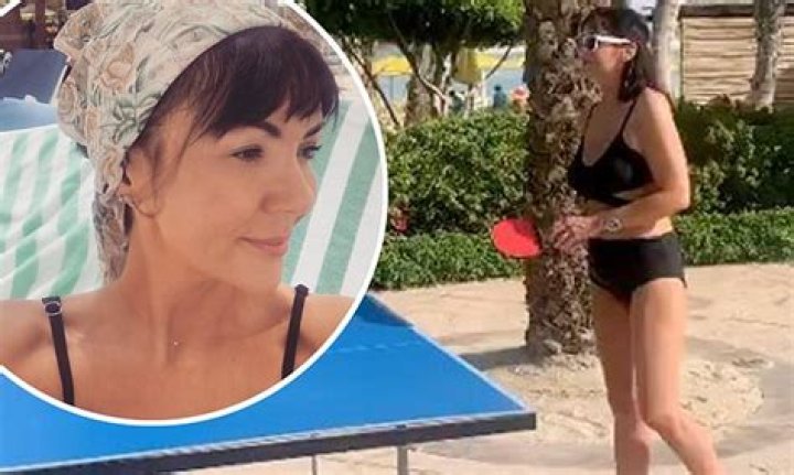 Martine McCutcheon puts on a leggy display in a bikini as she soaks up the sun on a family getaway