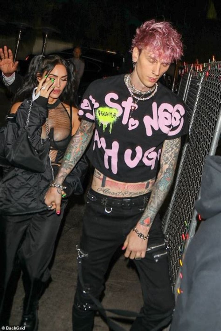 Megan Fox sizzles while Machine Gun Kelly shows off his new pink hair at Avril Lavigne concert