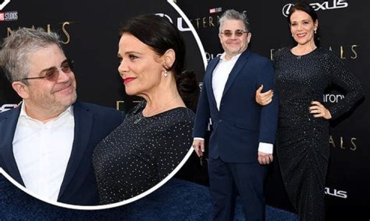 Meredith Salenger, 51, and Patton Oswalt, 52, look happy at the Eternals premiere