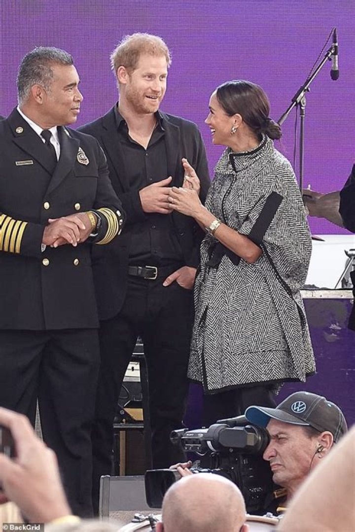 Moment Meghan Markle suffers a microphone mishap on stage at Kevin Costner's star-studded fundraiser