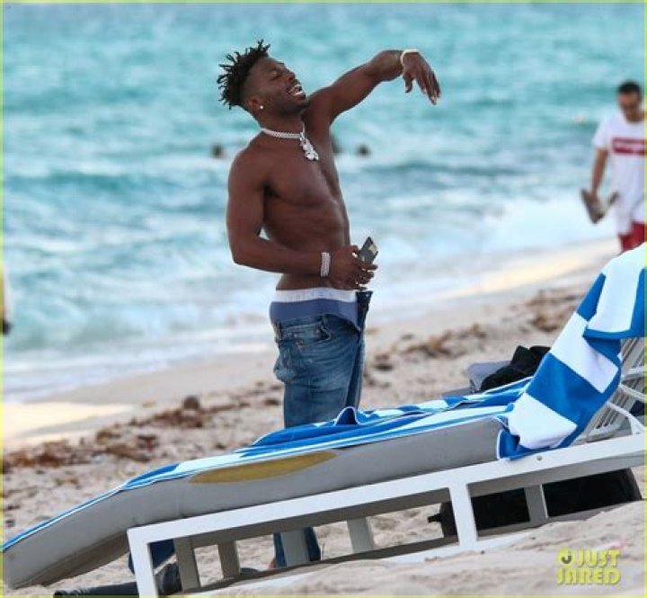 NFL Star Antonio Brown Channels Friend Kanye West While Going Masked at the Beach (Photos)