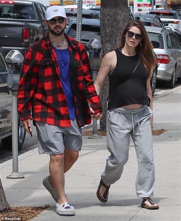 Pregnant Ashley Greene walks hand-in-hand with husband Paul Khoury in LA as they await 'baby Khoury'