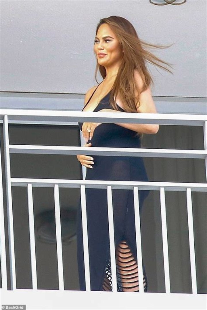 Pregnant Chrissy Teigen poses for snaps taken by son Miles after showing off expanding cleavage