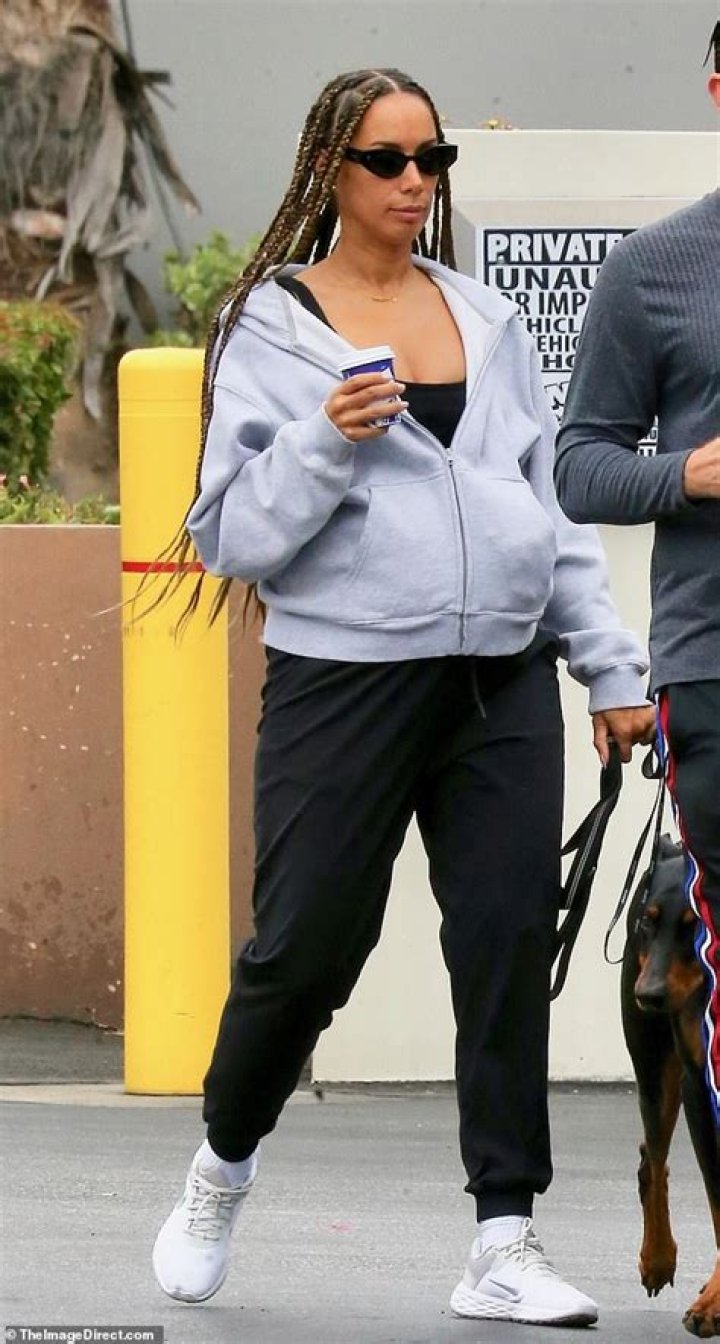 Pregnant Leona Lewis cuts a casual figure as she shows off her growing baby bump