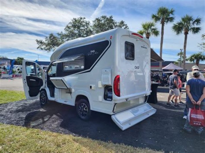 Retail worker who couldn't afford a motorhome transforms Fiat 500 into 'world's smallest camper van'
