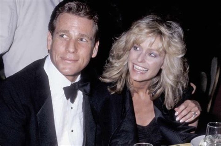 Ryan O'Neal is buried next to his longtime lover Farrah Fawcett: Love Story actor is farewelled at intimate ceremony in Los Angeles in front of his ex-wife Leigh Taylor-Young and their son Patrick after death at 82