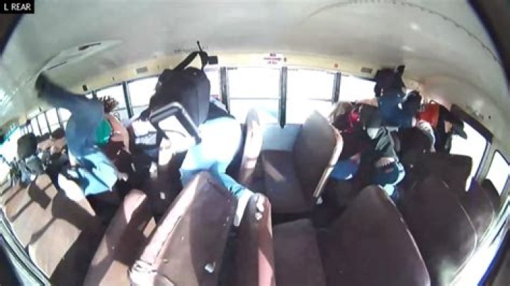 School bus with 23 students inside flips over when street racer causes crash in New Mexico: VIDEO