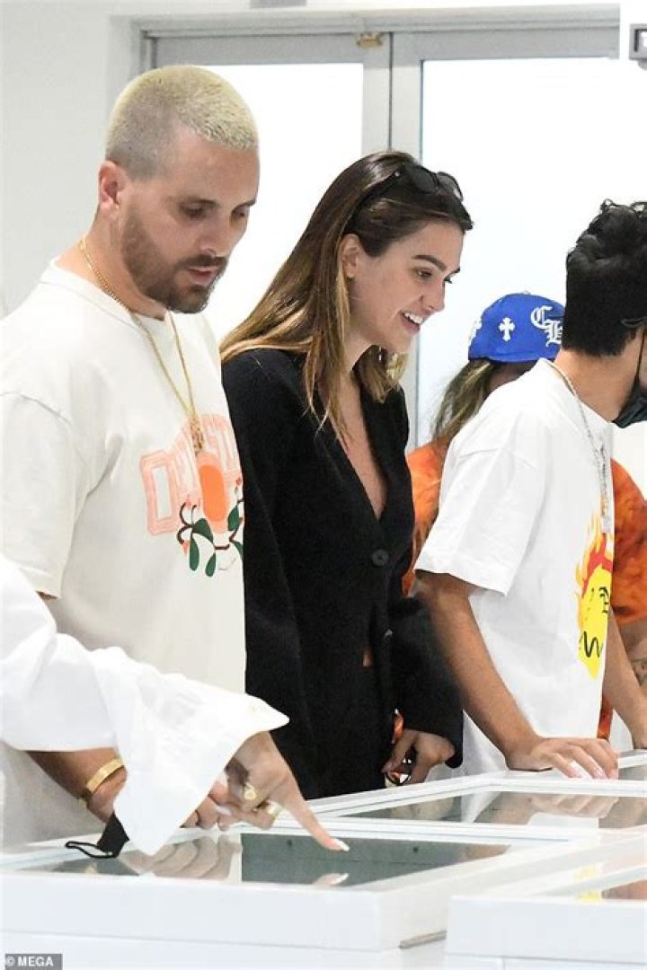 Scott Disick, and Amelia Hamlin, who flashes cleavage in black cardigan, shop for jewelry in Miami