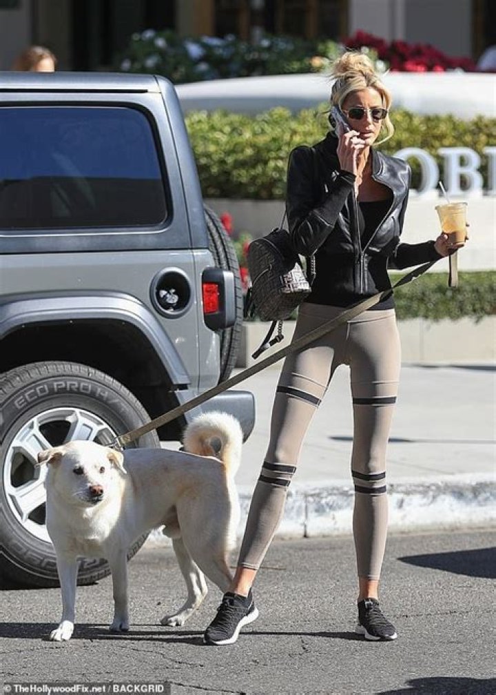 Selling Sunset star Emma Hernan oozes casual-cool dressed in leggings and leather jacket on dog walk