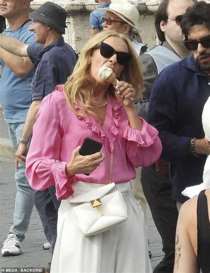 Toni Collette is pretty in pink on the Rome, Italy set of her mob action-comedy Mafia Mamma