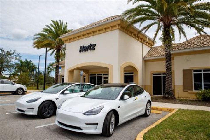 Uber helps drivers save money on gas by renting electric vehicles like Teslas through Hertz partnership